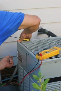 technician-working-on-air-conditioner
