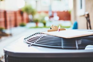 outdoor-air-conditioning-unit-with-clipboard