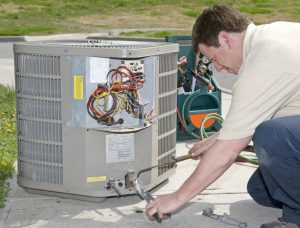 technician-welding-connection-for-ac-installation