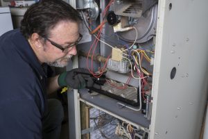 technician-working-on-heater