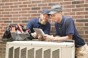 two-techs-working-on-ac